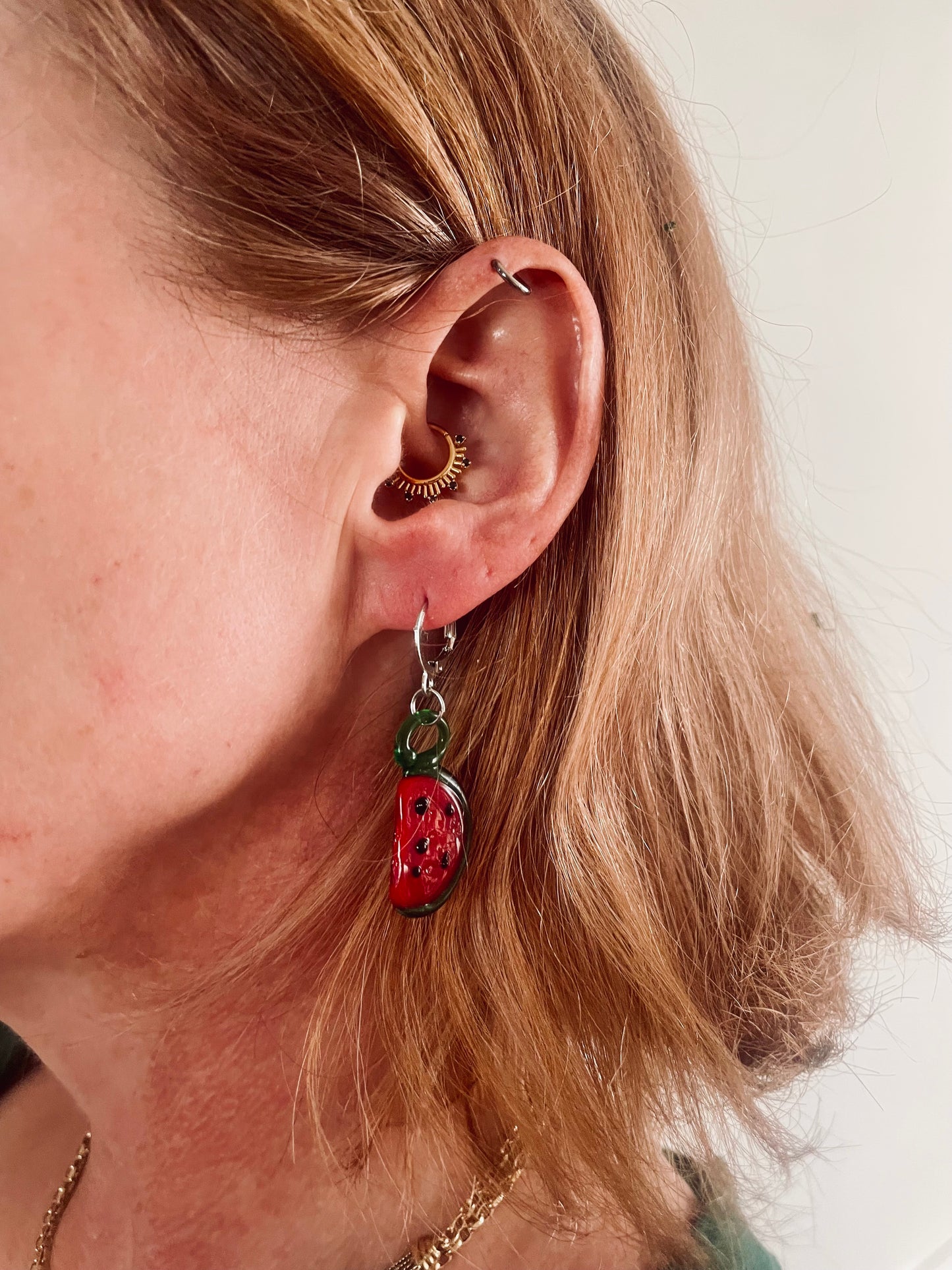 Glass watermelon earrings in aid of a mother in Palestine