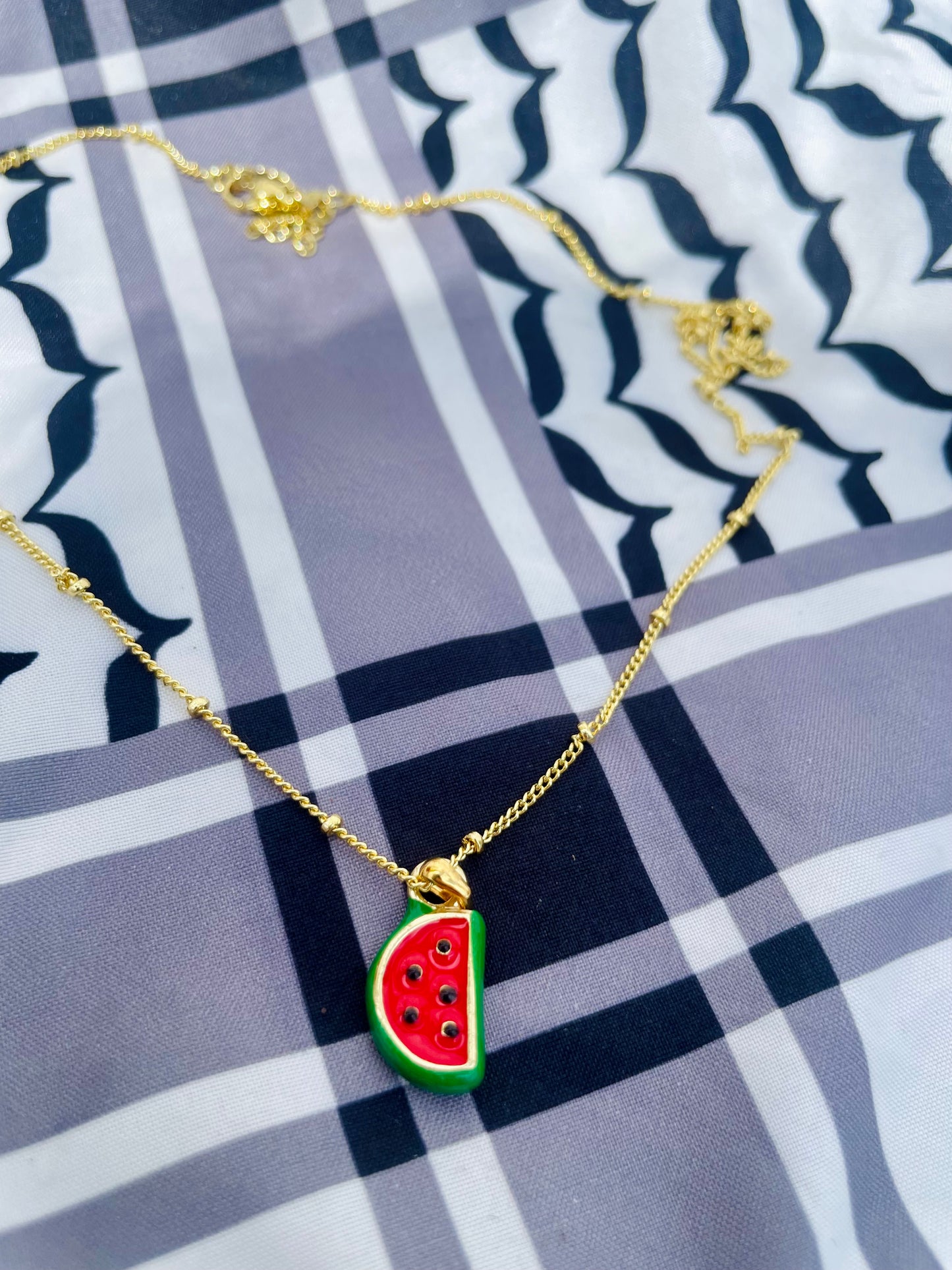 Watermelon pendant - gold plated brass sounds- in aid of a Palestinian mother.
