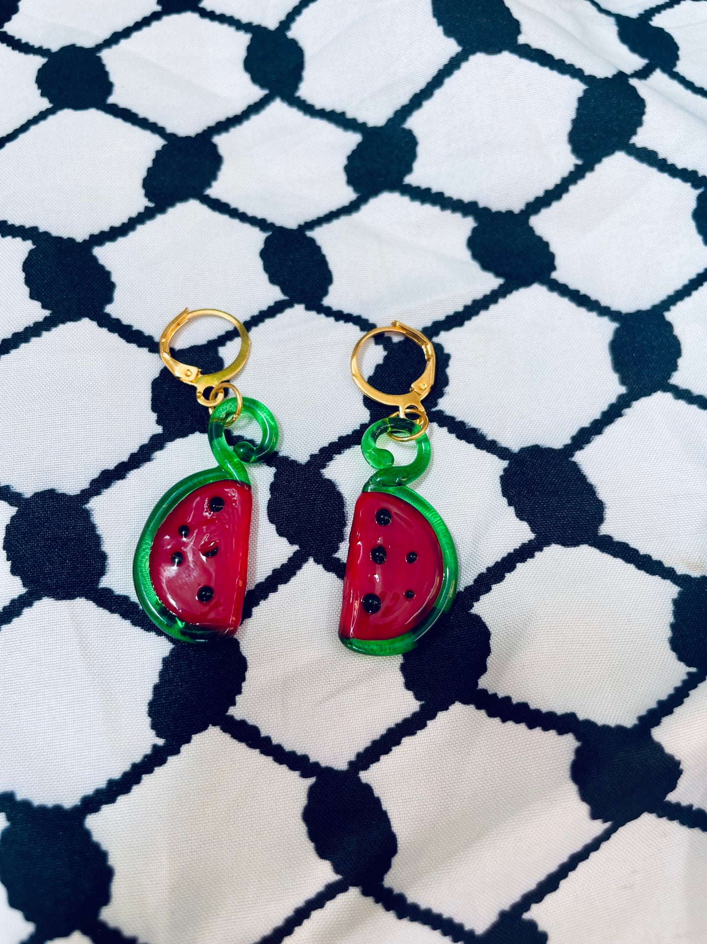 Glass watermelon earrings in aid of a mother in Palestine