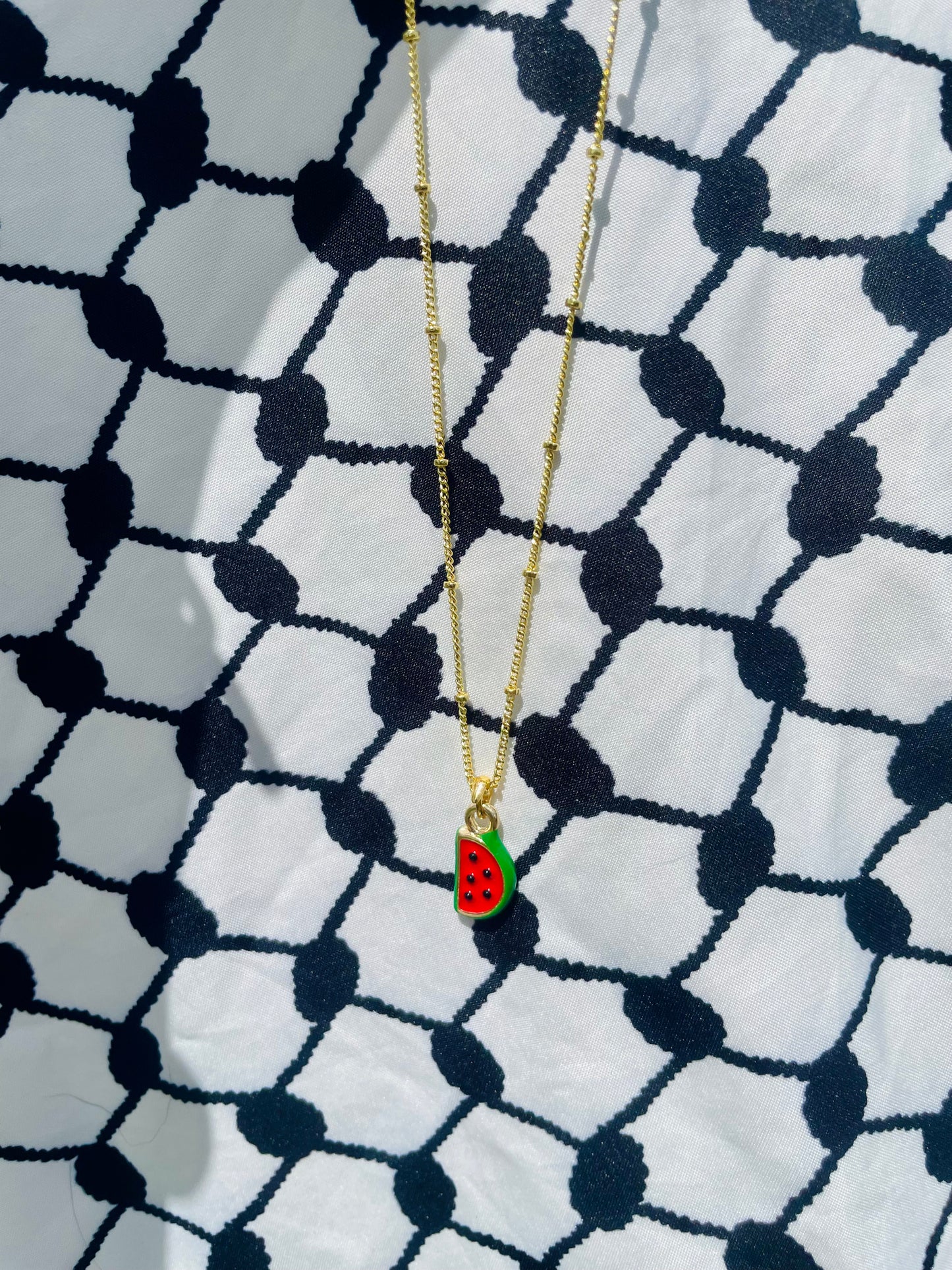 Watermelon pendant - gold plated brass sounds- in aid of a Palestinian mother.