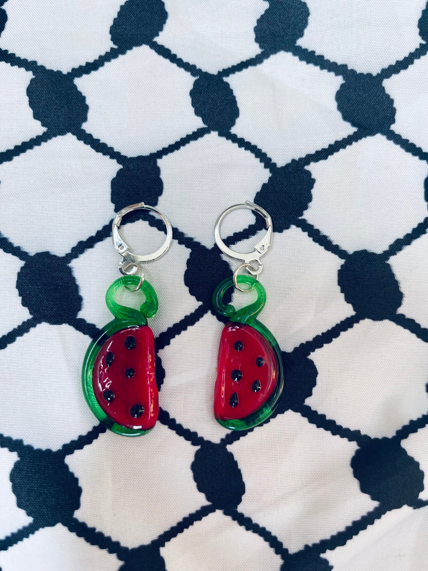 Glass watermelon earrings in aid of a mother in Palestine