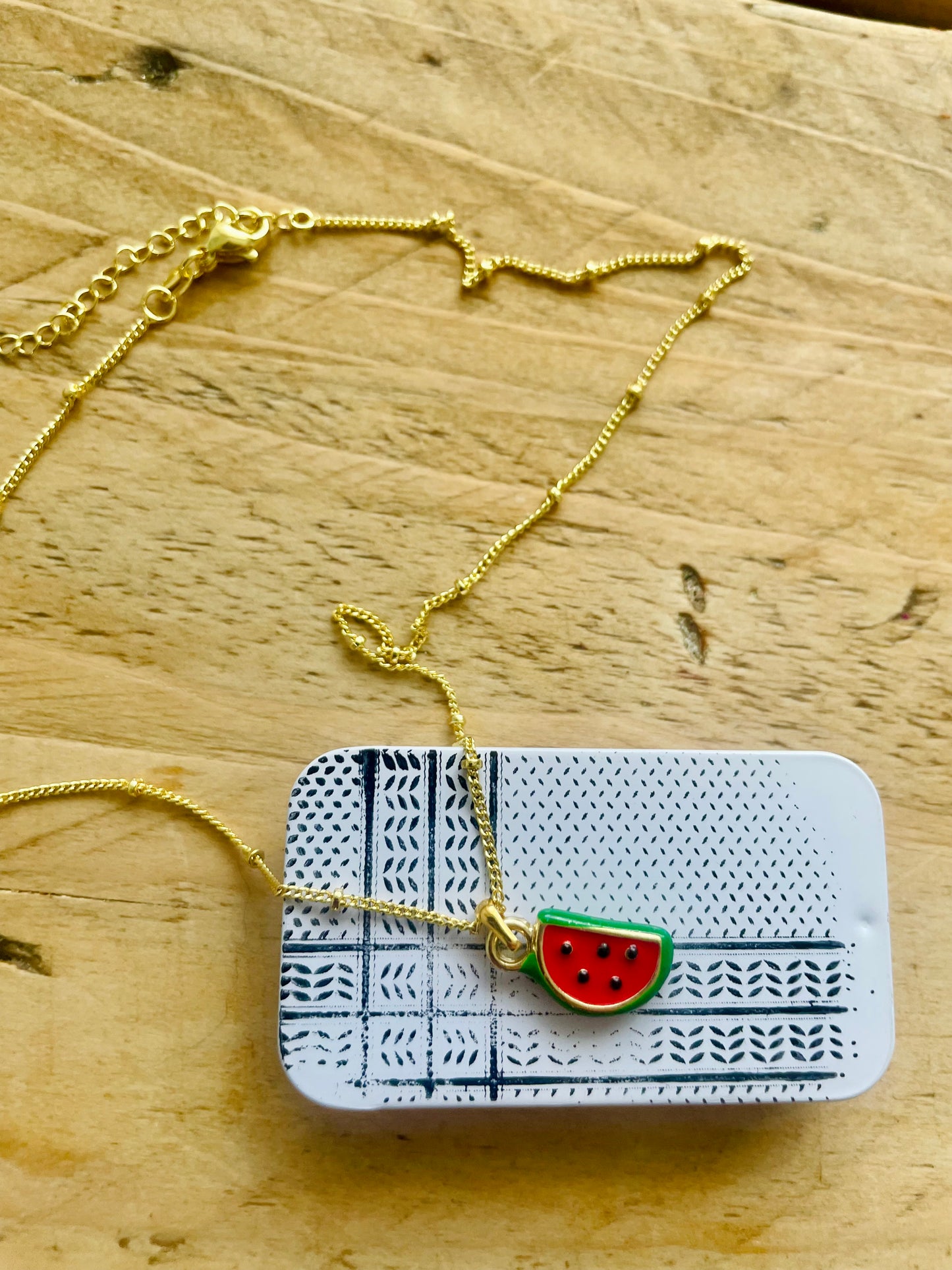 Watermelon pendant - gold plated brass sounds- in aid of a Palestinian mother.