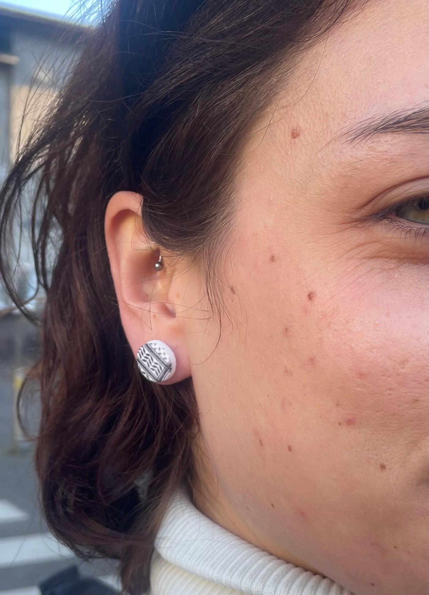 Keffiyeh earrings in aid of a Palestinian mother.