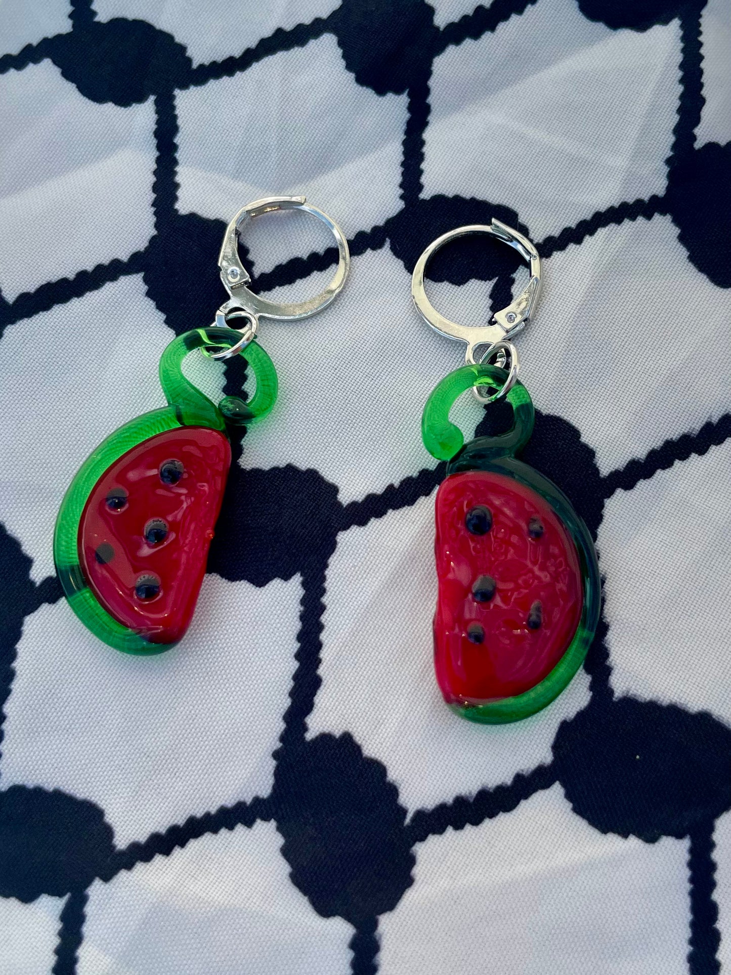 Glass watermelon earrings in aid of a mother in Palestine