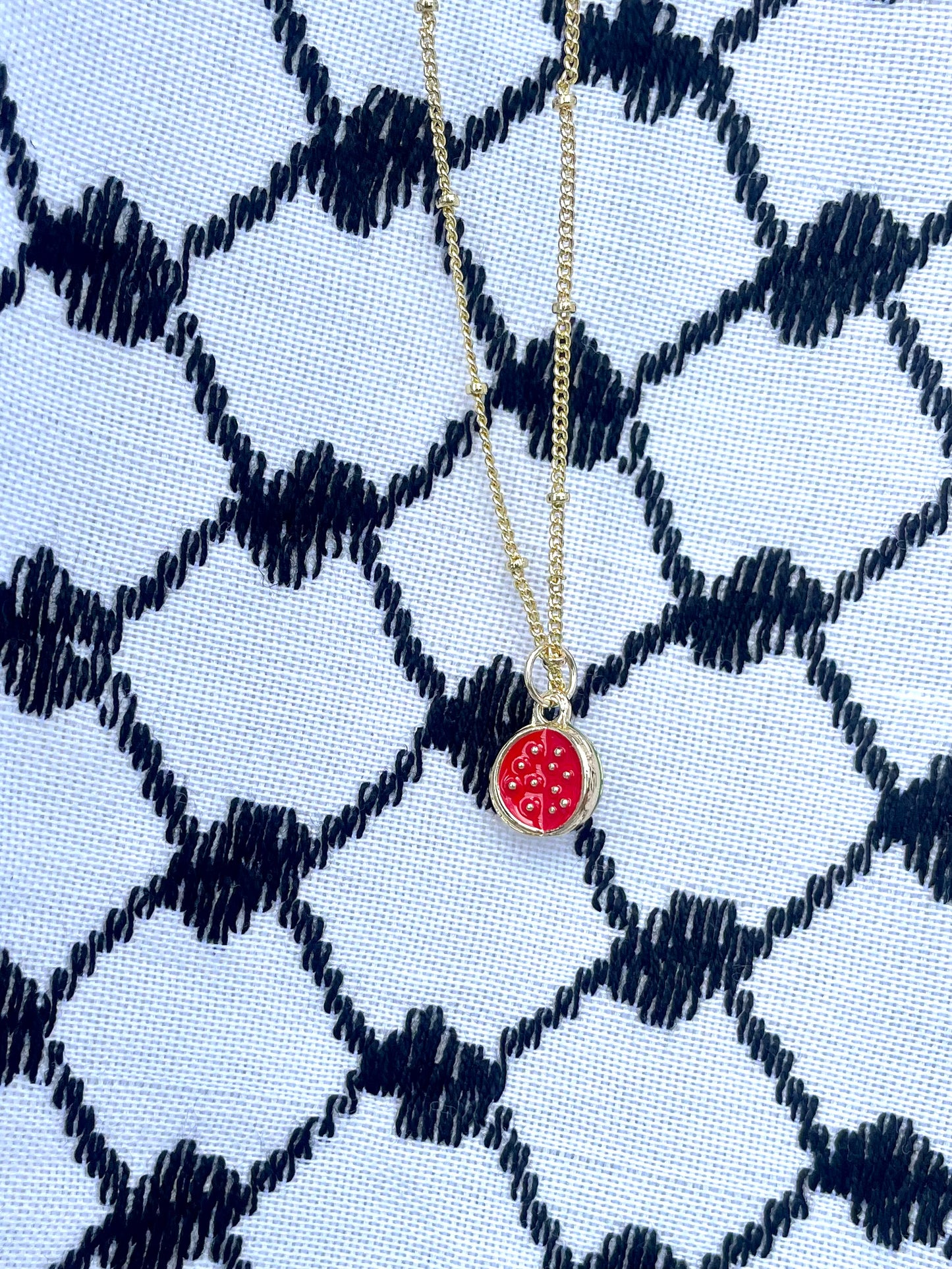 Watermelon pendant - gold plated brass sounds- in aid of a Palestinian mother.
