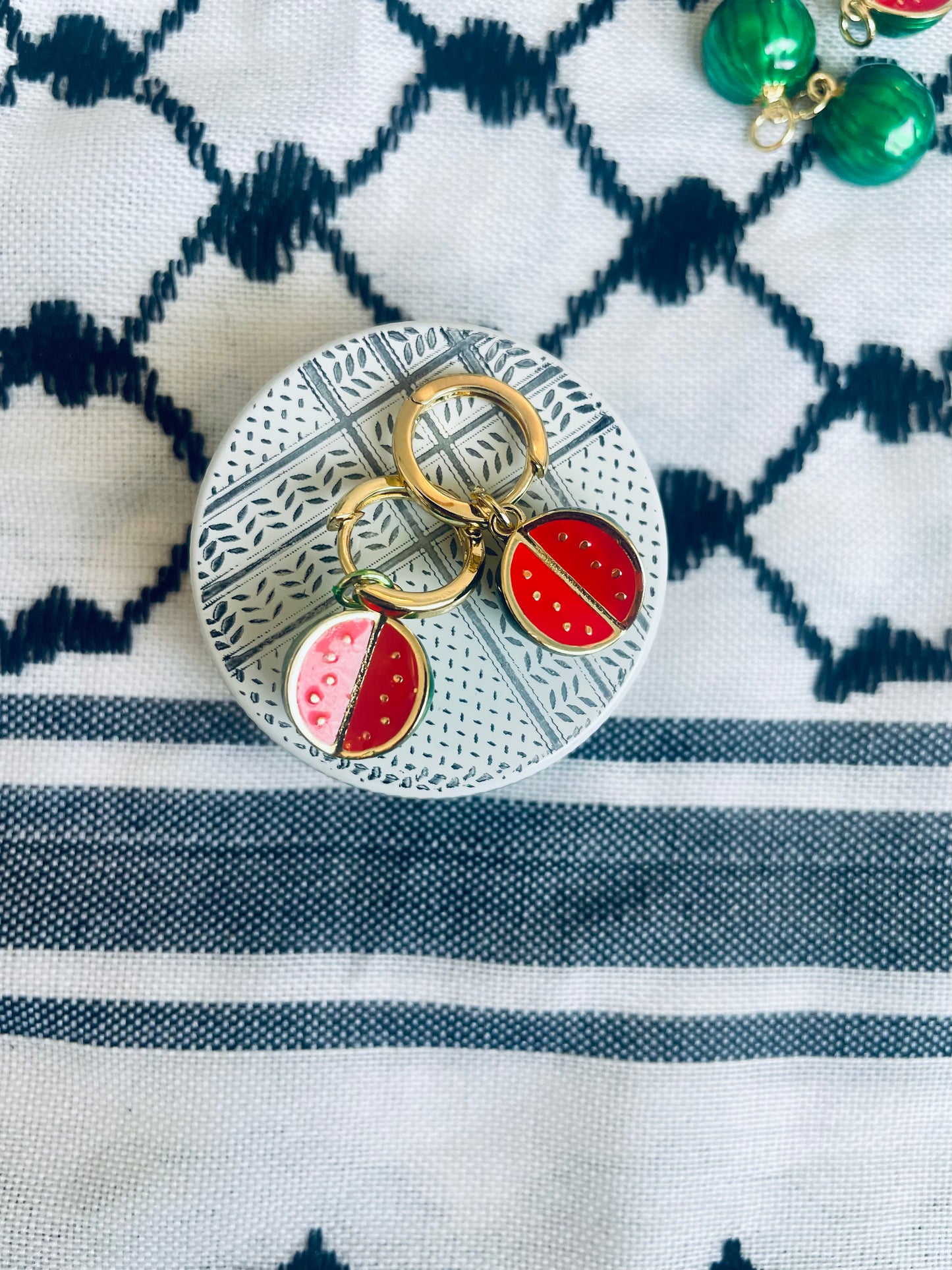 Round watermelon pendant in aid of Palestine.