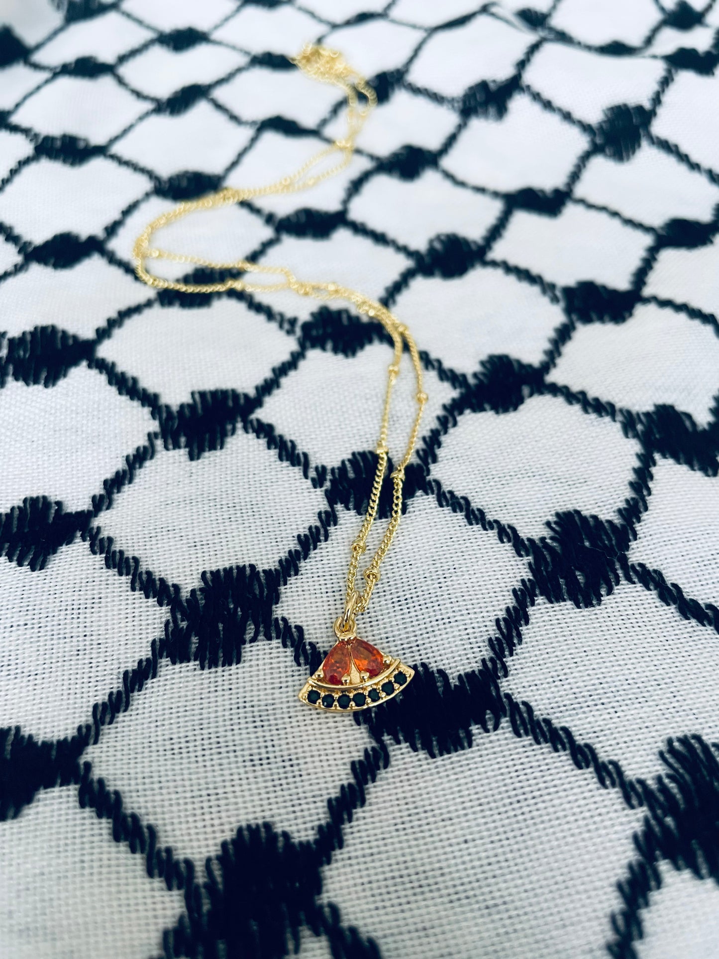Sparkle gold-plated watermelon pendant in aid of a Palestinian mother