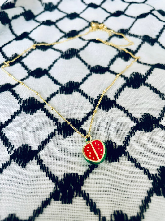 Round watermelon pendant in aid of Palestine.